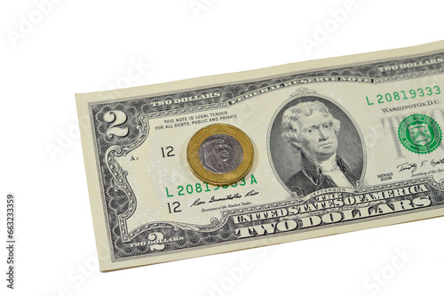 One Saudi Arabia riyal coin year 2016 on 2 American dollars USD paper banknote background, one metal SAR and USD banknote Saudi and American money, 1 Saudi riyal coin with the slogan of king Salman photo