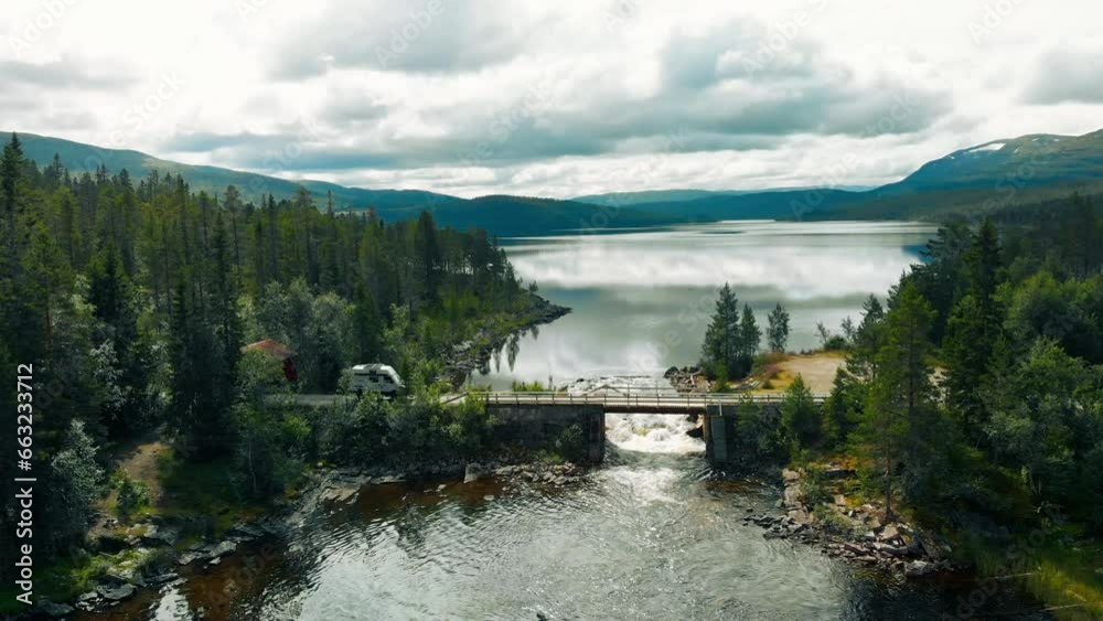 custom made wallpaper toronto digitalCool offroad overlanding rig, 4x4 full drive camper van with solar panel setup drive on secluded gravel road and bridge in remote area of Canada or Norway. Camper van outdoor lifestyle