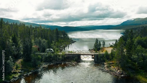 Wallpaper Mural Cool offroad overlanding rig, 4x4 full drive camper van with solar panel setup drive on secluded gravel road and bridge in remote area of Canada or Norway. Camper van outdoor lifestyle Torontodigital.ca