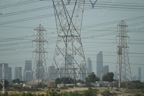 high power line constructions with Dubai in background