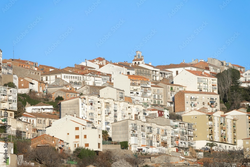Medieval village of Bejar at sunset with houses stacked on top of the mountain. Salamanca. Spain.