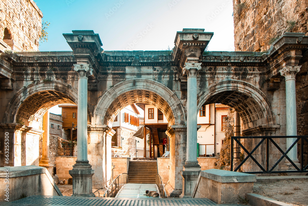Fototapeta premium ANTALYA, Turkey: Hadrian Gate with all its majesty and historical textures. An ancient structure made of marble and limestone.