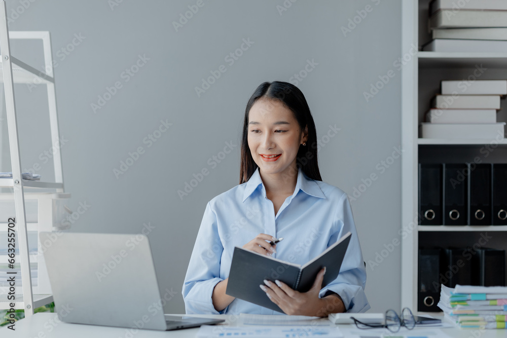 Asian woman sitting in startup company office, businesswoman, executive and investor in business and stocks, management of young people, new concept. Start-up company management concepts. Asian woman sitting in startup company office, businesswoman, executive and investor in business and stocks, management of young people, new concept. Start-up company management concepts.