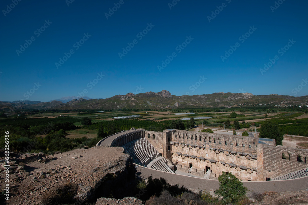 Roman amphitheater of the ancient city of Aspendos near Antalya, Turkey. An ancient ruined city.Aerial view.