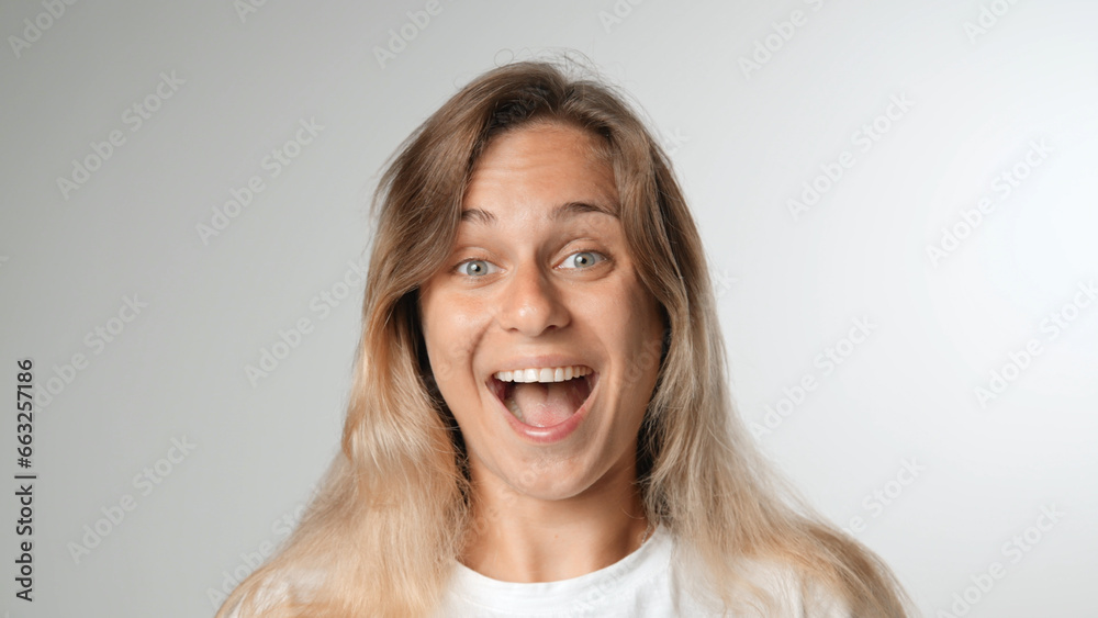 Beautiful person look at camera close up. Young adult woman face portrait. Stylish 30 years old girl on isolated white background. Attractive female feminism model. Modern millennial feminist people.
