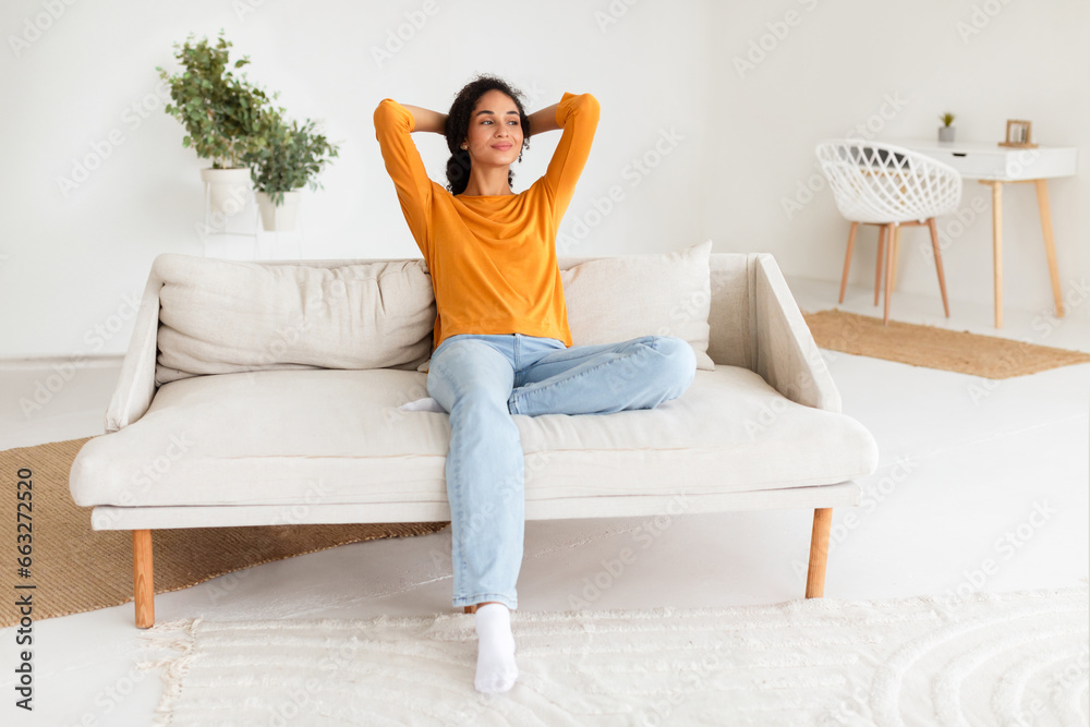 Casual Arabic lady resting on couch taking break at home Casual Arabic lady resting on couch taking break at home