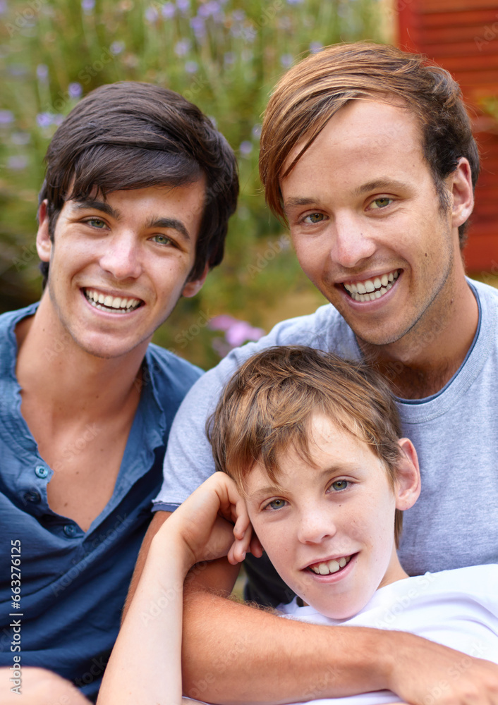 Portrait, men or brothers in backyard with smile, hug and bonding in garden of home or house outdoor. Family, people or child together with happiness and embrace for relax, peace or relationship Portrait, men or brothers in backyard with smile, hug and bonding in garden of home or house outdoor. Family, people or child together with happiness and embrace for relax, peace or relationship