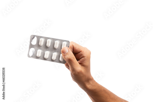 Hand holding blister pills on isolated no background cutout