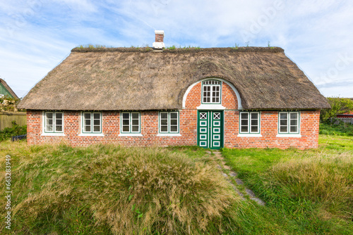 Typical thatched-roof cottage of Sønderho, Denmark photo