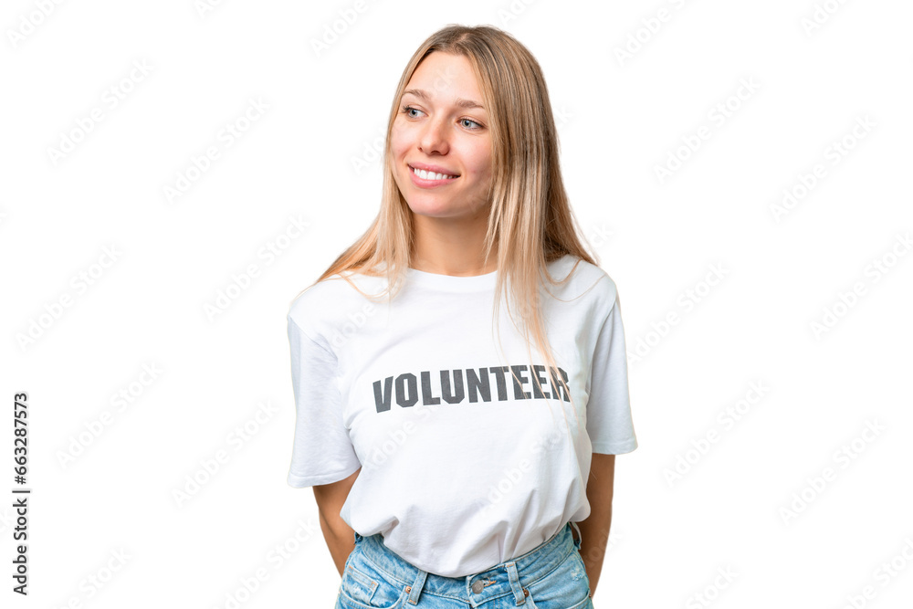 Young volunteer woman over isolated chroma key background looking to the side and smiling Young volunteer woman over isolated chroma key background looking to the side and smiling