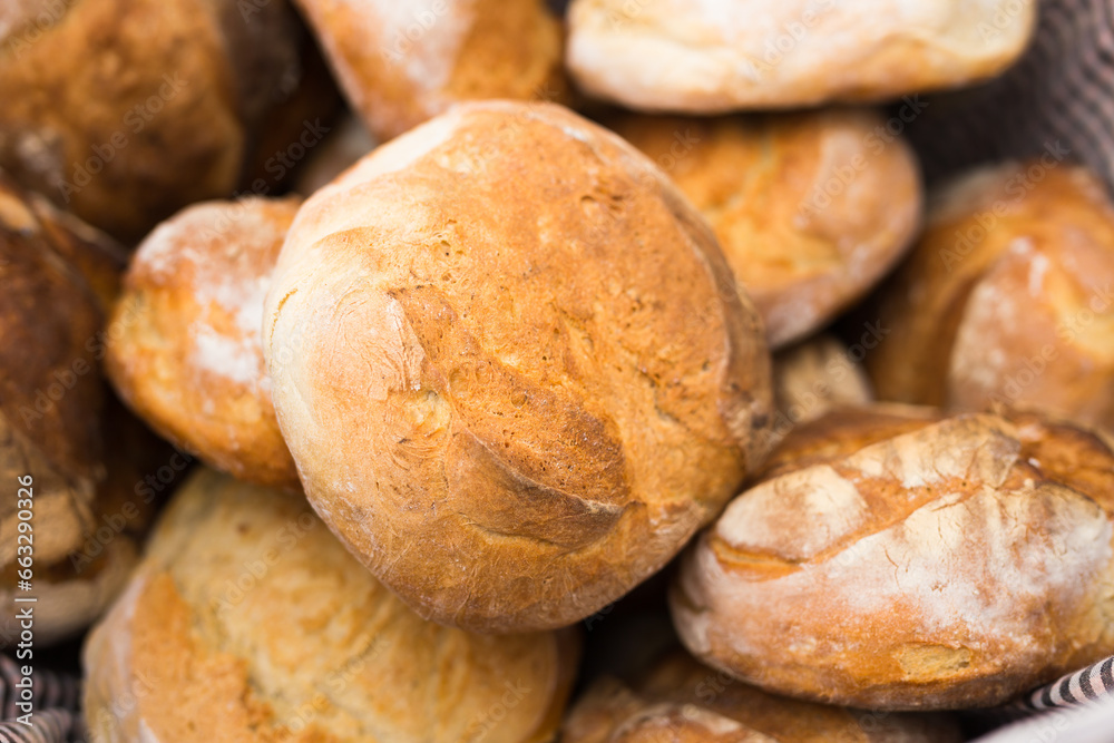 Ruddy rolls of fresh warm grain bread
