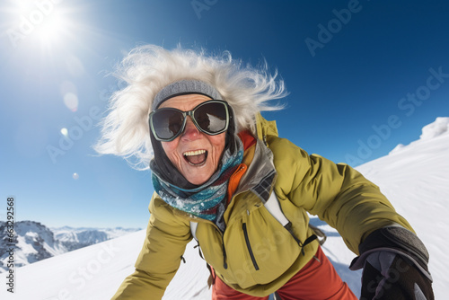 happy granny snowboarder in the mountains