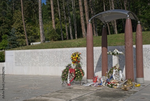 Tuzla, Bosnia and Herzegovina - Oct 4, 2023: This Slana Banja memorial complex remembers Tuzla residents killed or missing during the Bosnian War. Sunny autumn day. Selective focus. photo