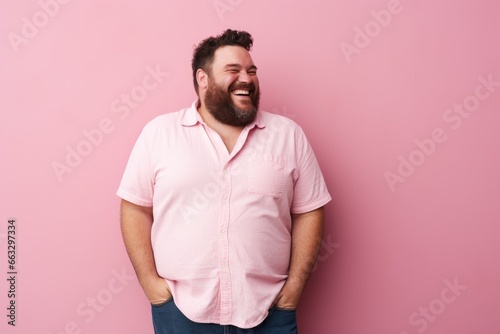 Portrait of a happy fat man laughing and looking at camera isolated over pink background. Created with Generative AI tools