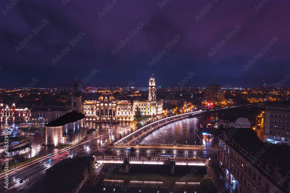Oradea romania tourism aerial a breathtaking night skyline from a bird's eye view, showcasing the city's iconic landmarks and rich historical heritage
