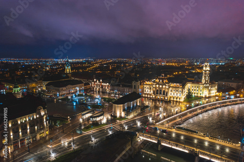 Oradea romania tourism aerial a vibrant cityscape illuminated at night showcasing its historic attractions
