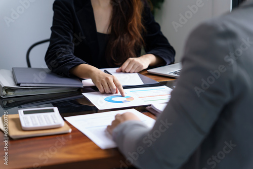 Businesswoman Accountant analyzing investment charts Invoice and pressing calculator buttons over documents. Accounting Bookkeeper Clerk Bank Advisor And Auditor