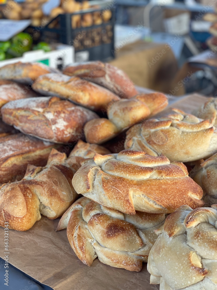 Different types of bread on a table at a weekly market