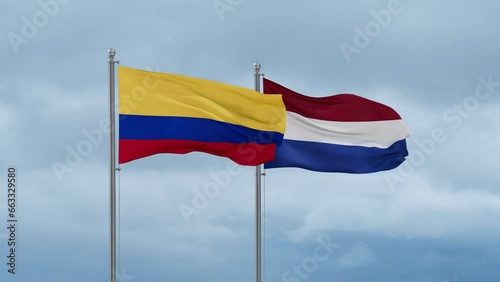 Netherlands flag and Colombia flag waving together on cloudy sky, endless seamless loop, two country relations concept photo