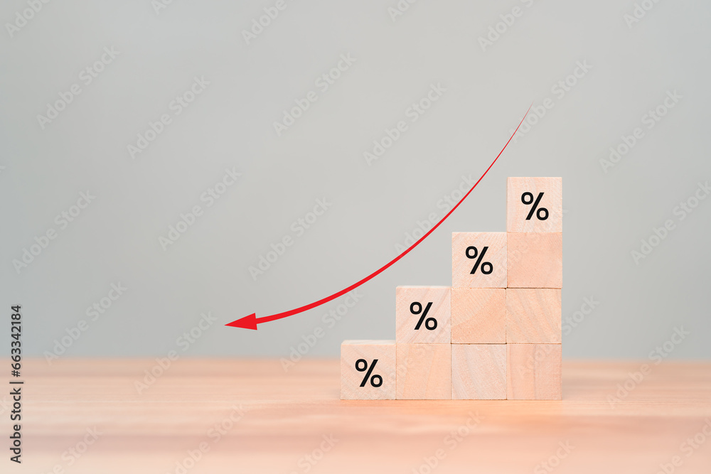 Wooden cube blocks with percentage sign and down arrow icon. Business ...