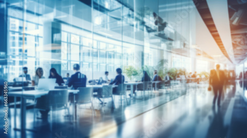 Blurred empty open space office. Abstract light bokeh at office interior background for design.