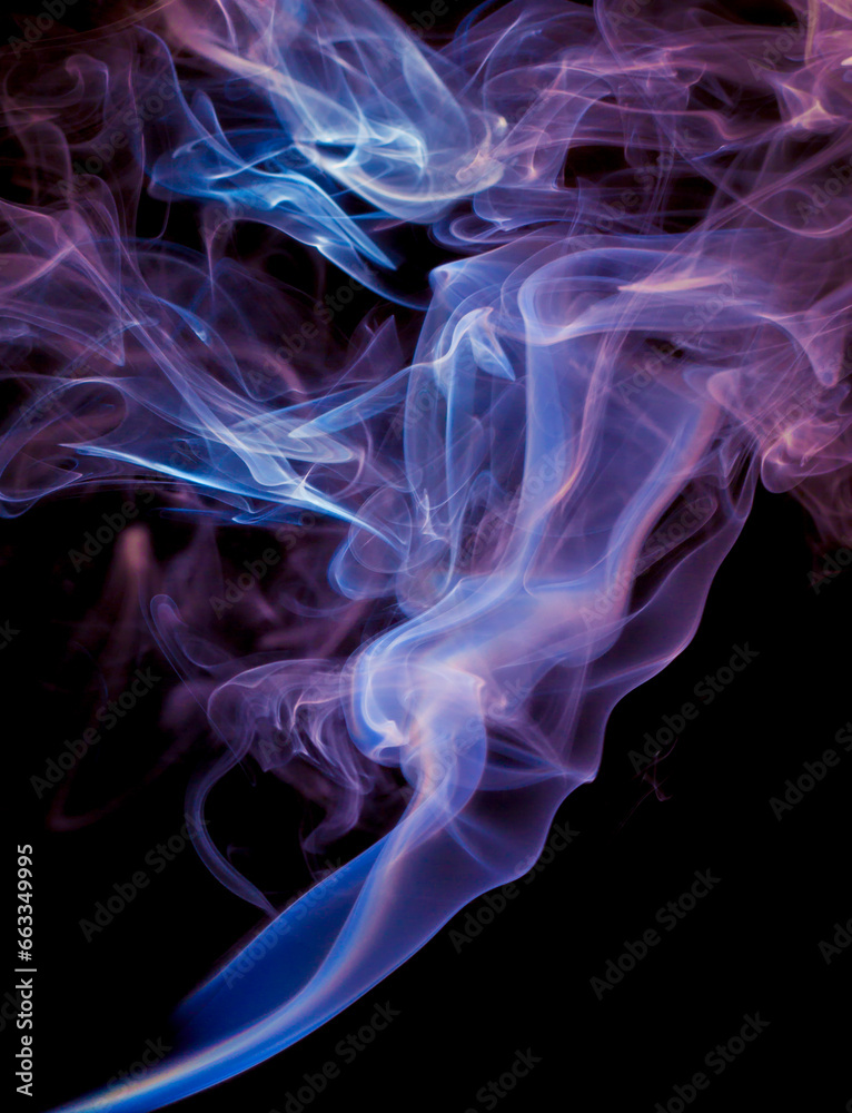 Fototapeta premium Vibrant color incense smoke on black