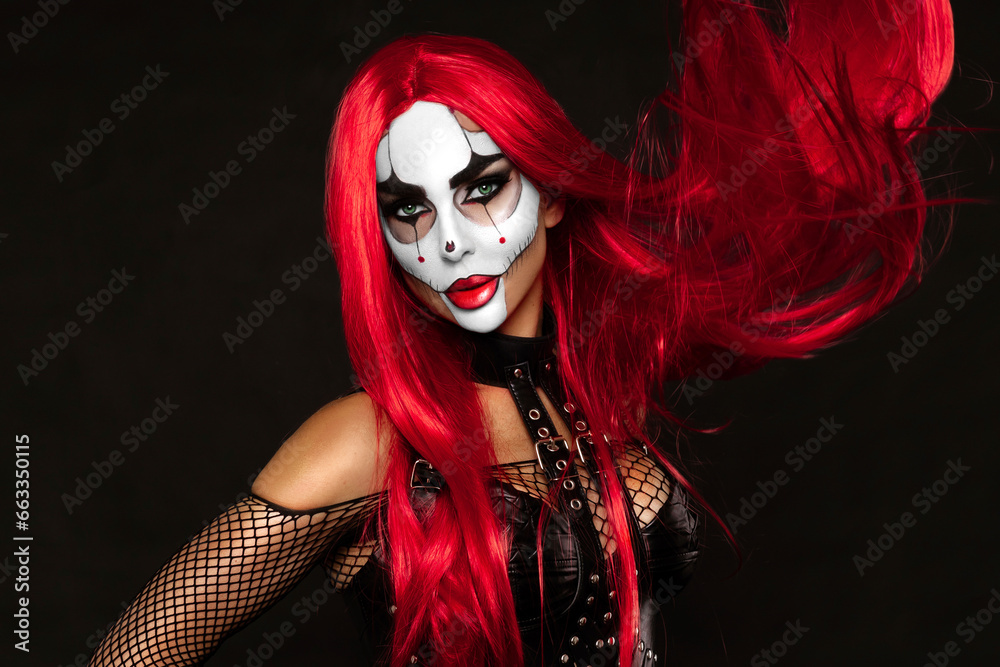 Obraz premium Sexy woman in a Halloween makeup on black background.