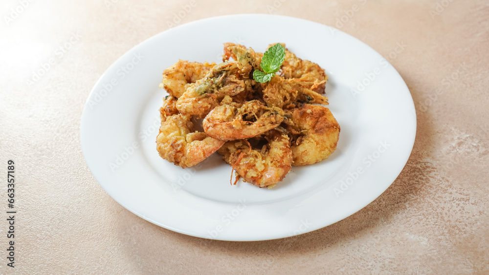 Crispy Shrimp on a white plate. Top angle. Crispy Shrimp on a white plate. Top angle.