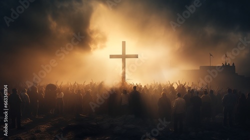 Silhouette of a crowd of people and a large cross at sunset