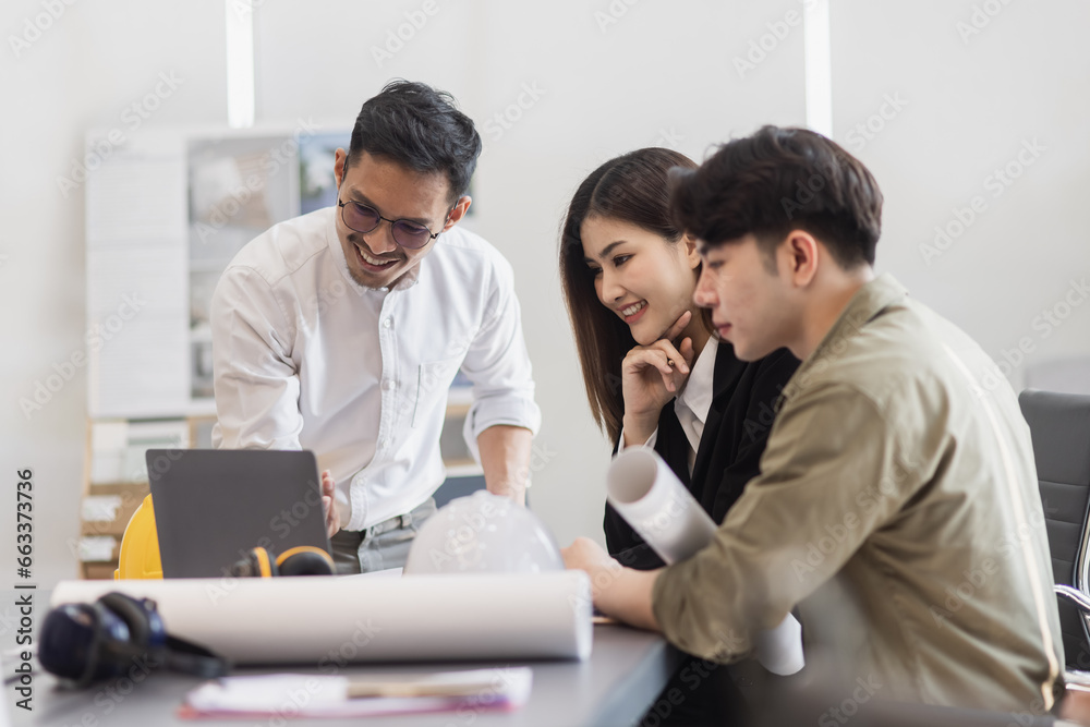 Team of interior designer. Engineers Team working through blueprints at desk, future building, interior design building project, Team of interior designer. Engineers Team working through blueprints at desk, future building, interior design building project,