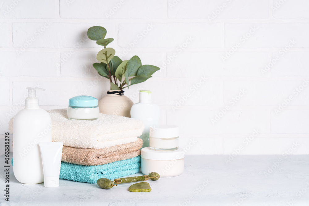 Bathroom with Cosmetic products and clean towels. Bathroom with Cosmetic products and clean towels.
