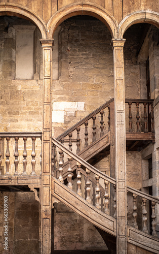 Old medieval wooden staircase of a bourgeois house in Dijon, Burgundy, France