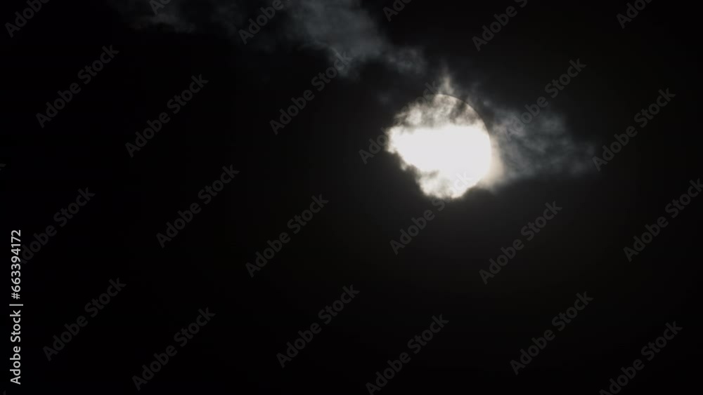 Mystical landscape of the setting sun. The sun is hiding behind storm clouds. Time-lapse . Mystical landscape of the setting sun. The sun is hiding behind storm clouds. Time-lapse .