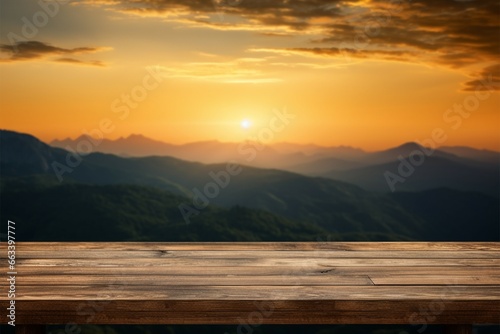 Wooden table with a stunning sunset sky and mountain backdrop © Jawed Gfx