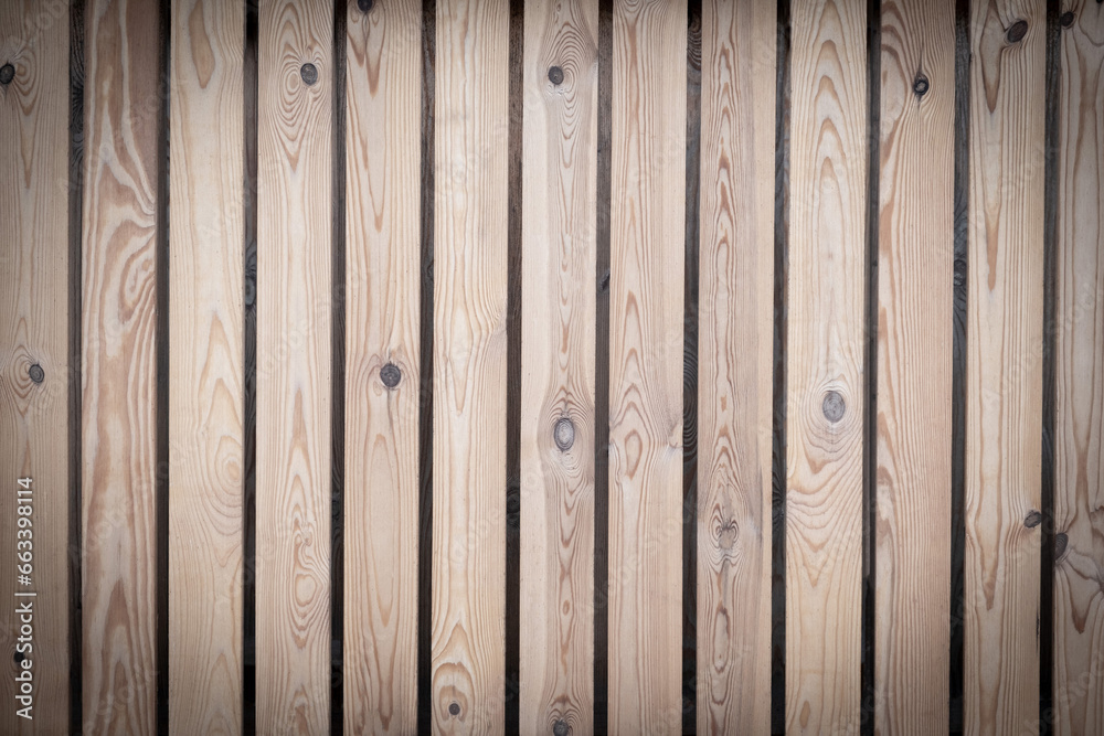 The background is made of pine planks arranged vertically. Space for text. High quality photo The background is made of pine planks arranged vertically. Space for text. High quality photo