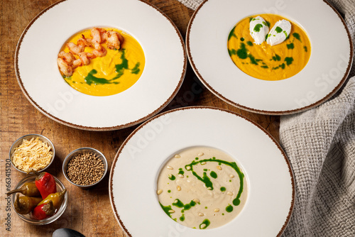Pumpkin soup with shrimps, cream and chives