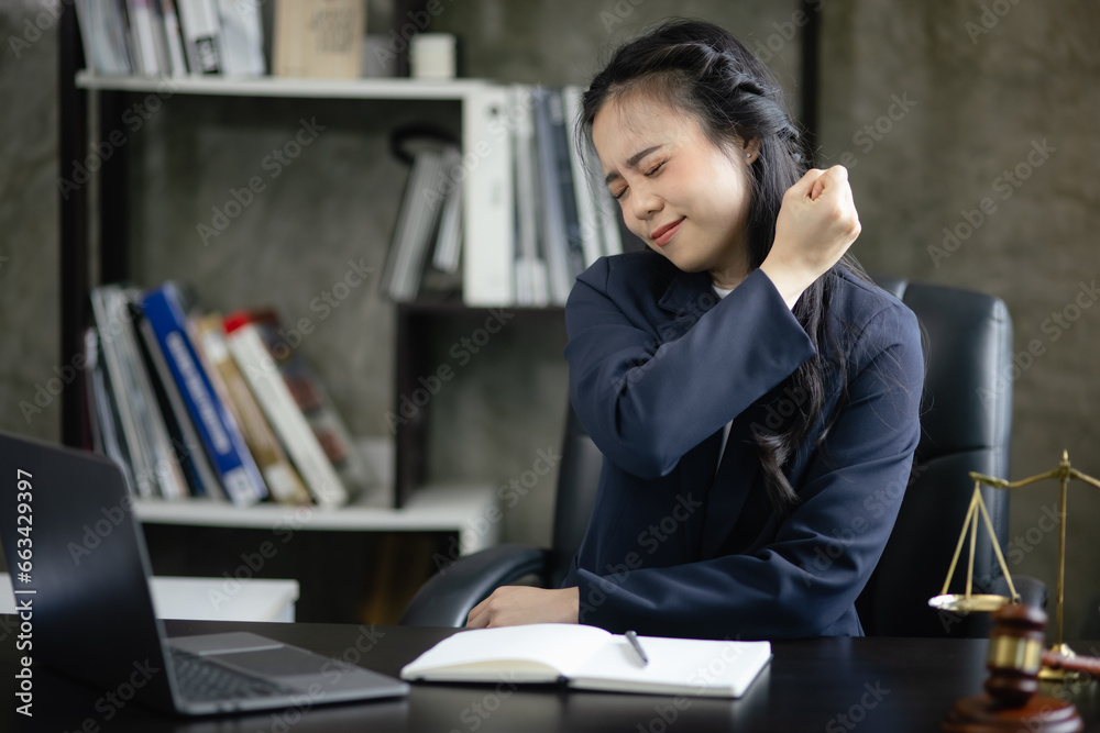 Lawyer woman stressed and tired from work in a courtroom, legal services, justice and law concept.