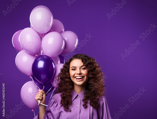 Horizontal shot of cheerful curly haired woman makes face palm dressed formally holds inflated balloons comes on graduation party celebrates her accomplishment isolated over purple background