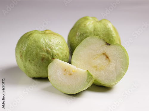 Crystal Guava (Psidium guajava) or Jambu Kristal, served in white ceramic square plate isolated in white background, copy space. photo