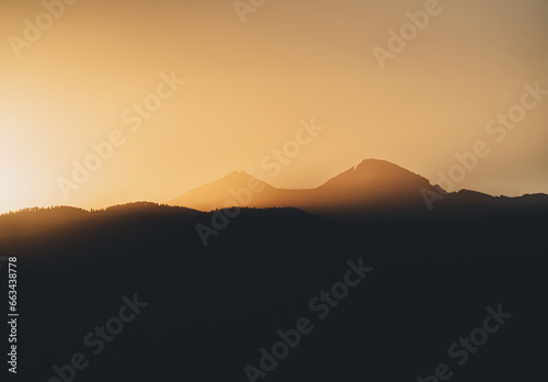 Silhouetted Mountain Peaks at Sunset in Colorado   Longs Peak and Mt Meeker During Golden Hour © mattgrandbois