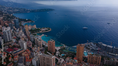 Aerial view over the city of Monaco, Monte Carlo. Photography was shoot from a drone at a higher altitude from above the city with skyscrapers and the coast in the view on a stormy weather. © Ioan