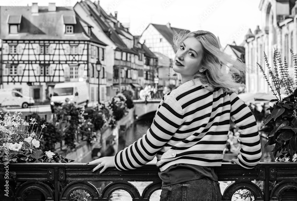 Vacation in France. Traveling and adventure concept. Beautiful European Blonde Woman at town, tourism concept scene