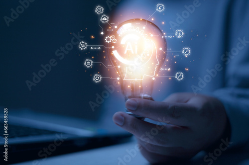 Photo with a man holding a light bulb and a glowing AI icon and a business icon. Concept of using artificial intelligence in business and daily life.