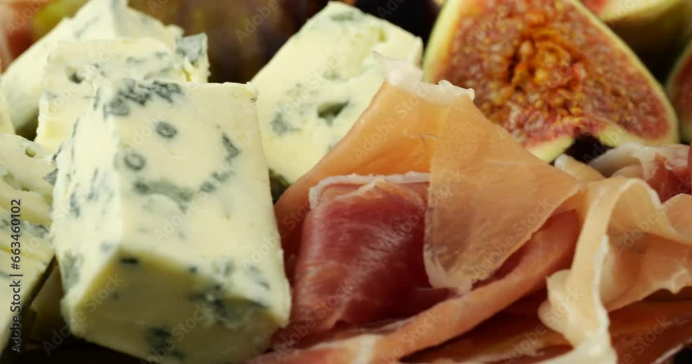 Figs, jamon, spinach leaves and blue cheeses. Snacks set. Figs, jamon, spinach leaves and blue cheeses. Snacks set.