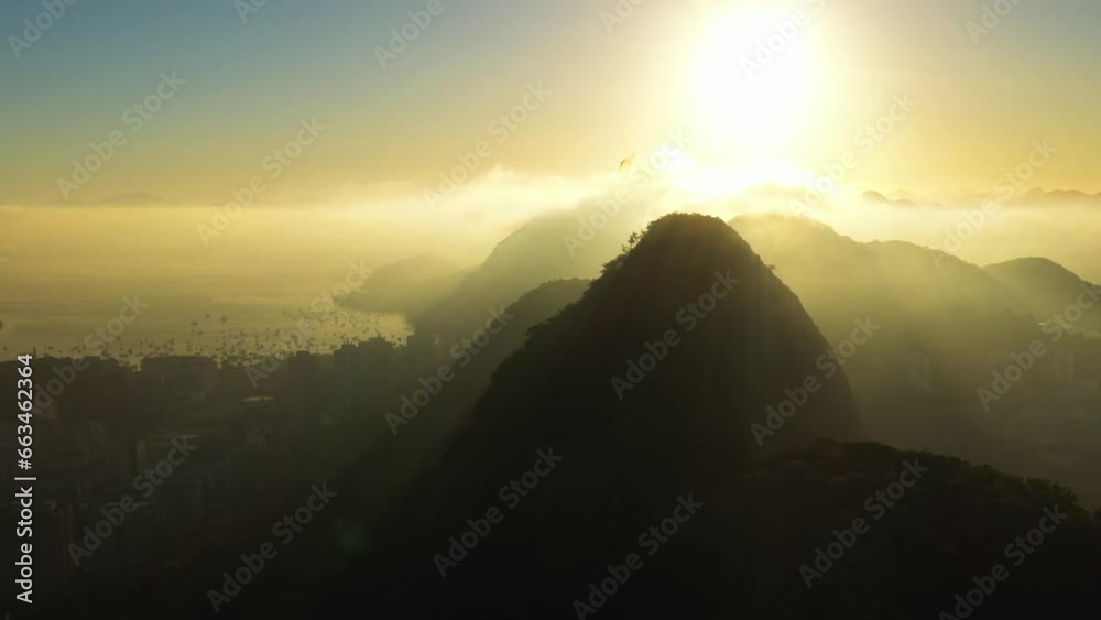 Aerial view of Rio de Janeiro suburban district surrounded by hills at sunset, Rio de Janeiro, Brazil. Aerial view of Rio de Janeiro suburban district surrounded by hills at sunset, Rio de Janeiro, Brazil.
