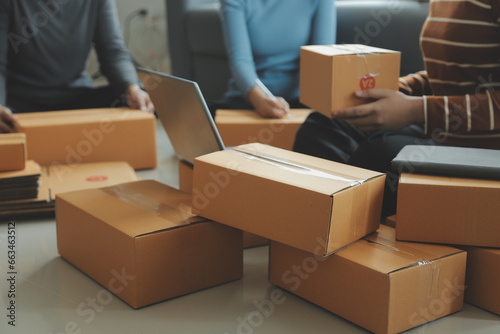 Business woman start up small business entrepreneur SME success .freelance woman working at home with Online Parcel delivery. SME and packaging deliveryconcept
