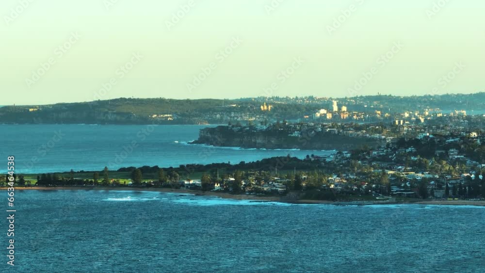 Aerial view of Narrabeen bay, a suburban area north of Sydney along the coastline at sunset, Sydney, New South Wales, Australia. Aerial view of Narrabeen bay, a suburban area north of Sydney along the coastline at sunset, Sydney, New South Wales, Australia.