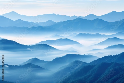 Layered mountain ranges softened by early morning fog © Dan