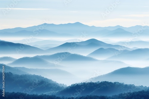 Layered mountain ranges softened by early morning fog © Dan