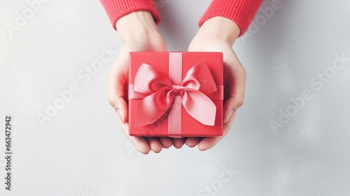 Top view han holding red gift box isolated white background. AI generated image